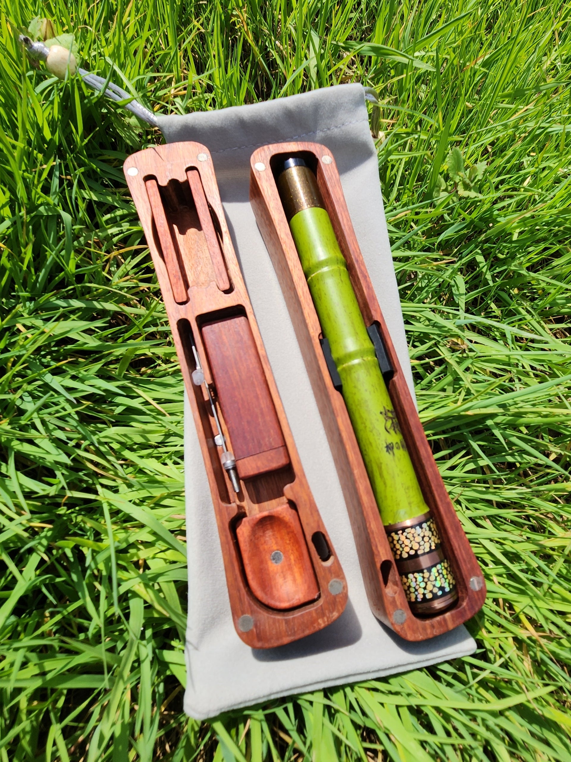 green bamboo telescopic fishing rod on grass