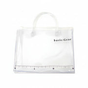 Clear tote bag with 'basic:Gear' branding on a white background