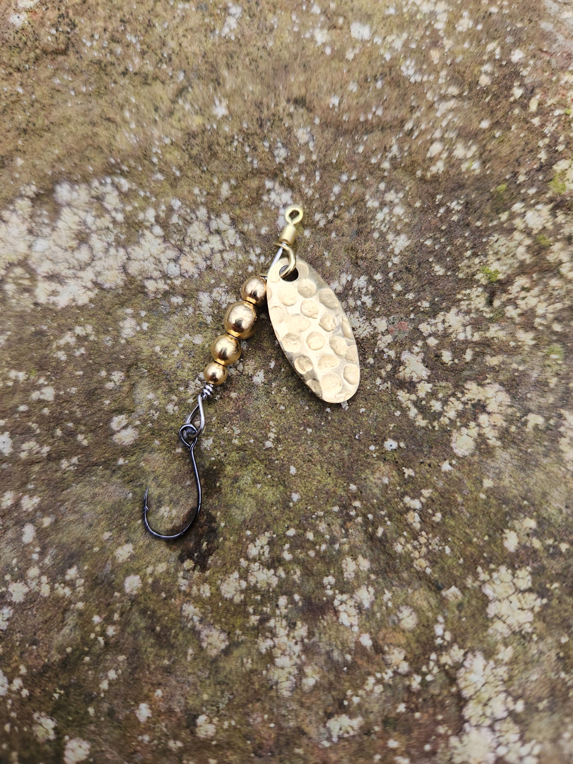 swiss swing lure with single hook and built in swivel to eliminate line twist